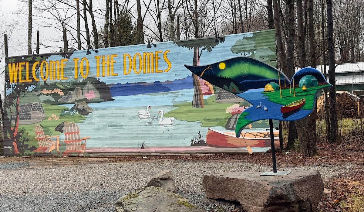 Welcome to the Domes sign